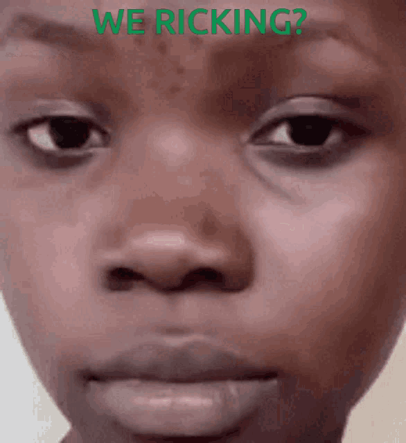 a close up of a person 's face with the words " we ricking " behind it