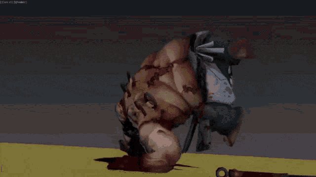 a computer screen shows a man laying on the ground with a knife on the ground