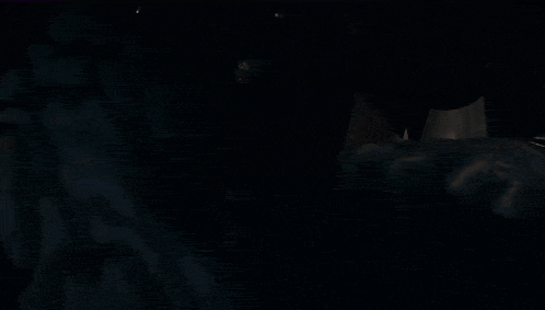 a man with blood on his face is being punched by a glove