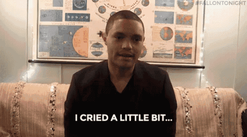 a man is sitting on a couch and says i cried a little bit .