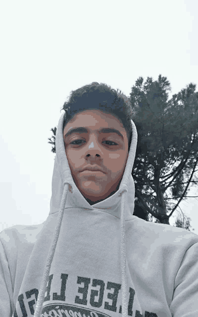 a young man wearing a hoodie that says ' ege ' on the front