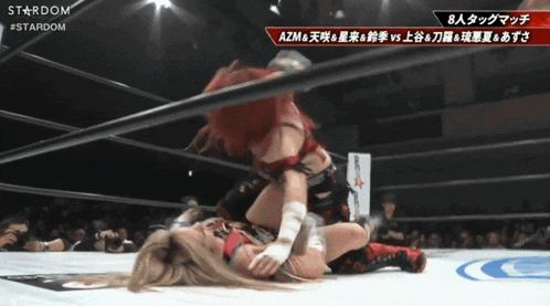 two women are wrestling in a ring with a stardom logo on the bottom