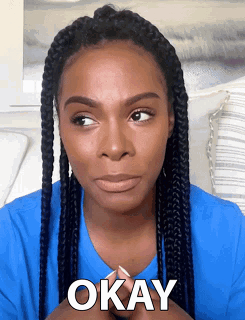 a woman wearing a blue shirt says okay