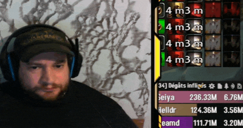 a man wearing headphones next to a screen that says 4 m3m
