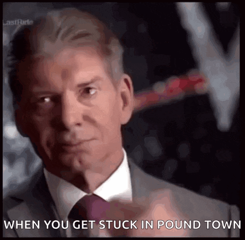 a man in a suit and tie is pointing at the camera with the caption when you get stuck in pound town