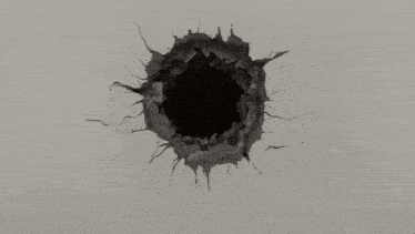 a hole in a wall with a black hole in the center