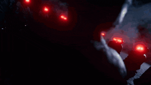 a row of red lights on a dark background