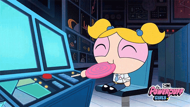 bubbles from the powerpuff girls is sitting in front of a computer