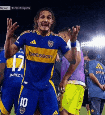 a soccer player wearing a blue and yellow jersey with betsson on it