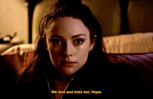 a close up of a woman 's face with the words we love and miss her hope