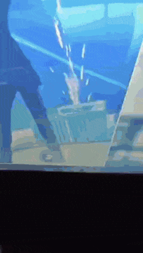 a blurry picture of a person standing in a pool of water