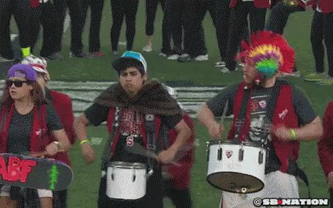 Stanford Drummer With Rainbow Mohawk At 2014 Rose Bowl GIF - Band Rose Bowl Marching Band GIFs