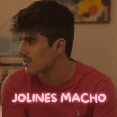 a man wearing a red shirt with the name jolines macho written in pink