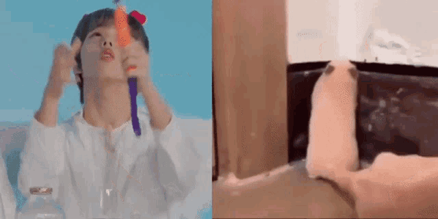 a man is holding a carrot in his mouth and a cat is playing with a toy .