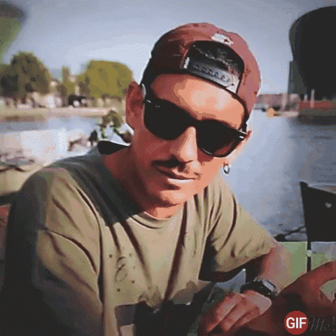 a man wearing sunglasses and a hat with the word gif on the bottom right