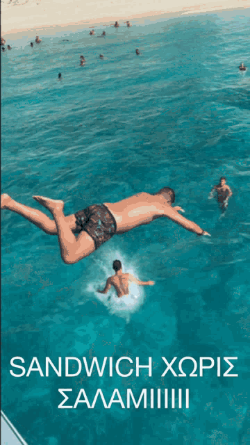 a man is jumping into a pool with the words sandwich xopis salamiiii written below him