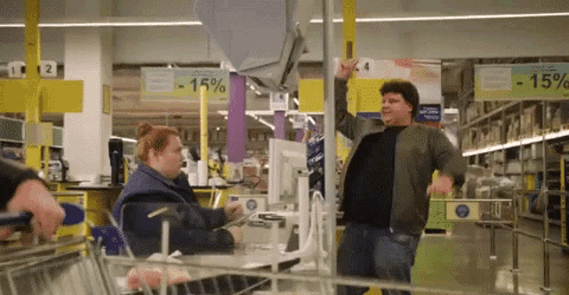 a man and a woman in a store with a sign that says -15 % on it