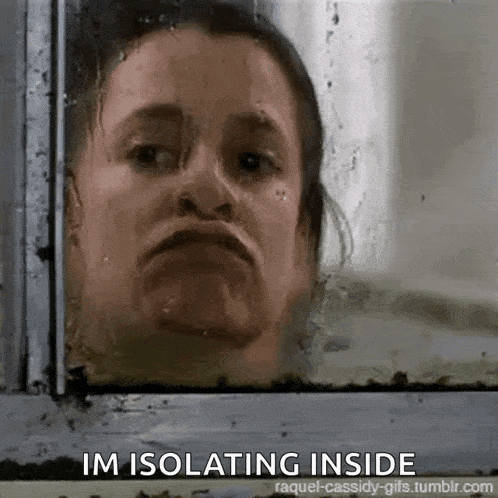 a woman is looking out of a window with the words `` im isolating inside '' written below her .