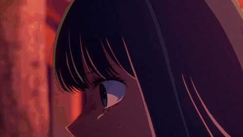 a close up of a girl 's face with a tear coming out of her eye