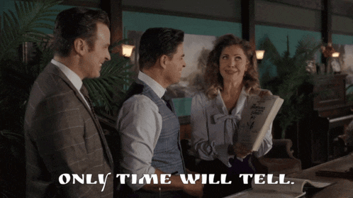 two men and a woman are standing next to each other with the words only time will tell below them