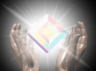 a pair of hands holding a glowing cube in their hands