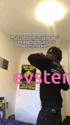 a man is standing in a room with a sign that says evster