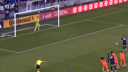 a soccer game is being played on a field sponsored by audi