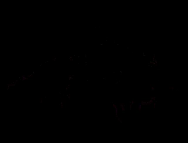 a colorful image of a person laying down with a black background