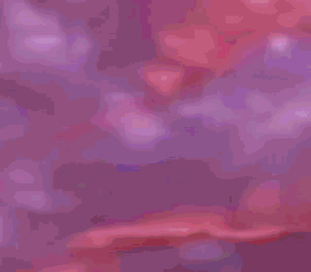 a purple background with a few white clouds in the sky