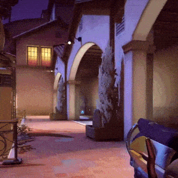 a building with arches and a purple light on the side