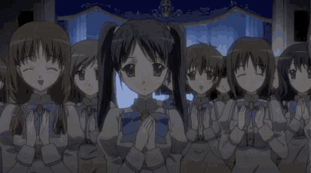 a group of anime girls are praying together with their hands folded