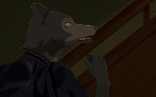 a close up of a wolf 's face with a fist in the air