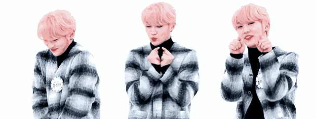 a man with pink hair is wearing a plaid jacket and making a heart with his hands