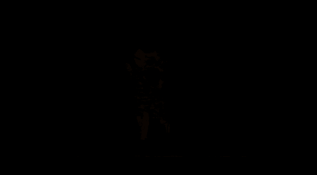 a silhouette of a man holding a sword and a woman holding a bottle