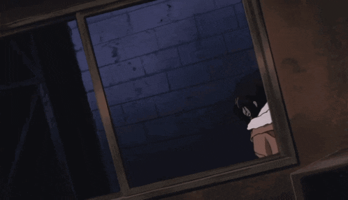 a girl in a brown coat is looking out a window