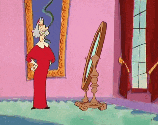 a cartoon character is standing in front of a mirror and looking at himself .
