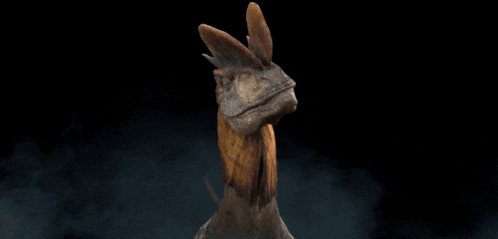a close up of a dinosaur with its mouth open and its tongue out