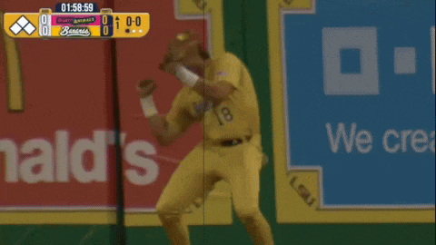 a baseball player wearing a yellow jersey with the number 18