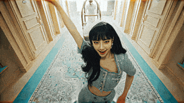 a woman is standing in a hallway wearing a tiara