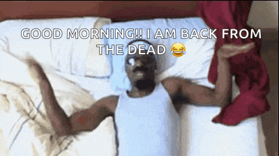 a man is laying on a bed with the words good morning i am back from the dead written on the bottom