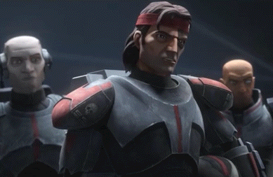 a group of soldiers in armor are standing next to each other .