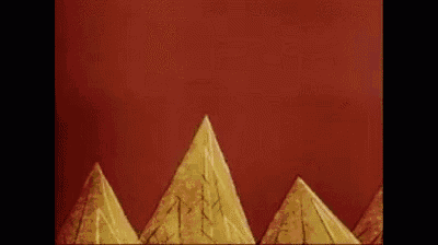 a cartoon character is standing on top of a mountain with pyramids in the background .