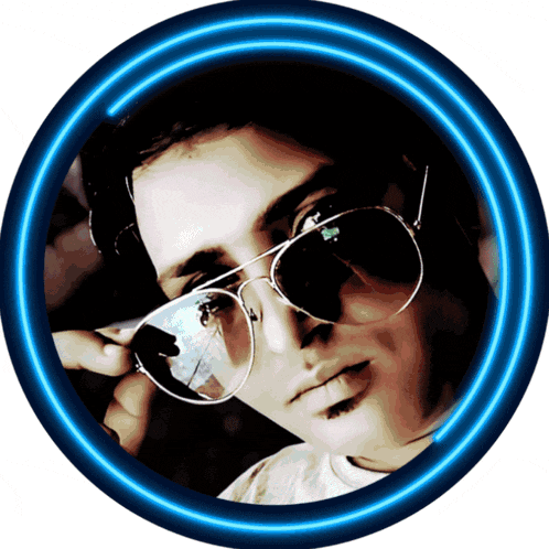 a man wearing sunglasses and headphones is in a blue neon circle