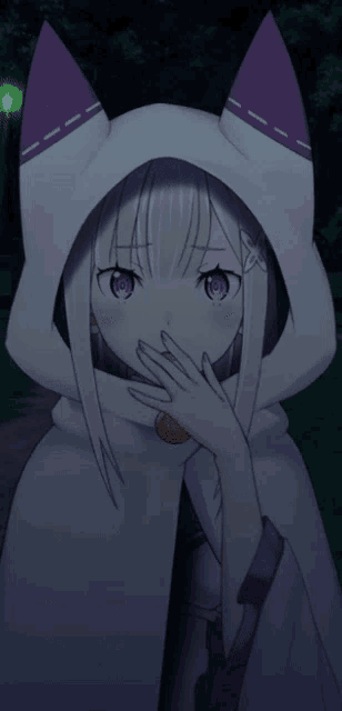 a girl wearing a white cape with purple ears covering her mouth