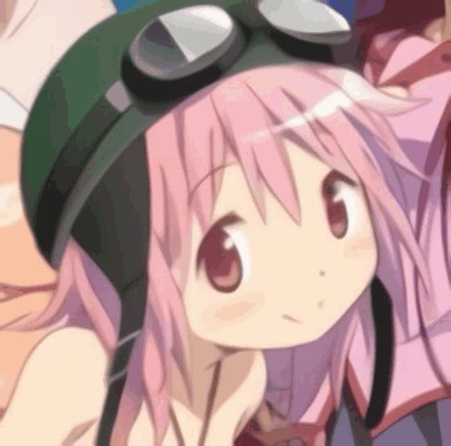 a girl with pink hair is wearing a green helmet and goggles