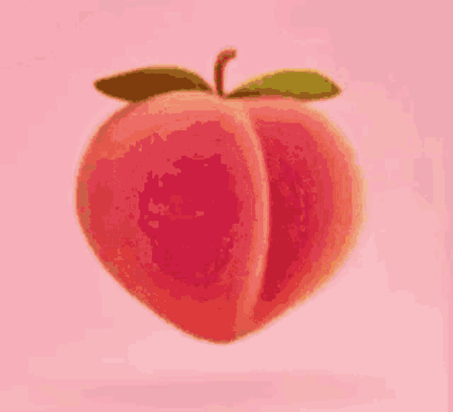 a peach with a green leaf on it is on a pink background .