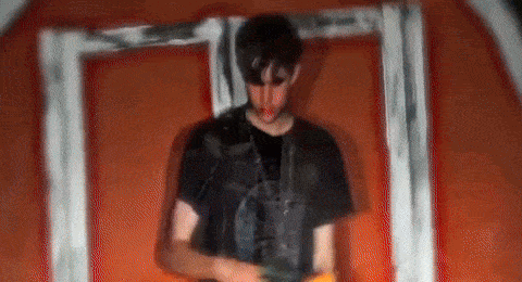 a blurry picture of a man standing in front of a door