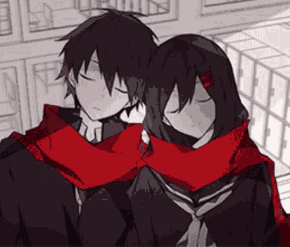 a boy and a girl are hugging each other with their eyes closed while wearing scarves .