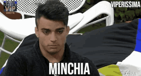 a man with the word minchia written on his shirt