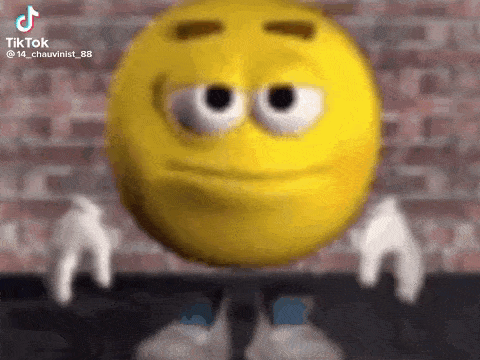 a cartoon smiley face with big eyes and arms is standing in front of a brick wall .
